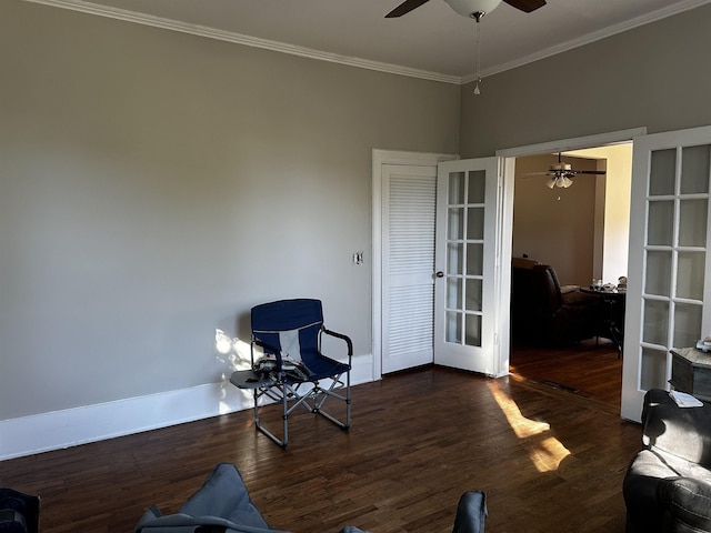 living area with dark hardwood / wood-style flooring, ornamental molding, and french doors