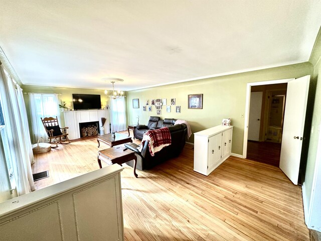 dining space with a chandelier and light wood-type flooring