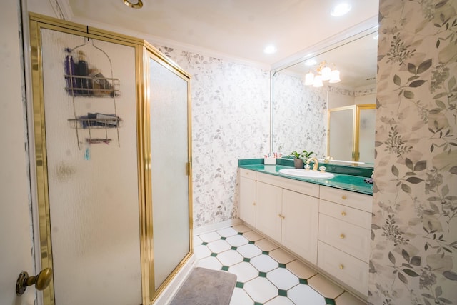 bathroom with ornamental molding, an enclosed shower, and vanity