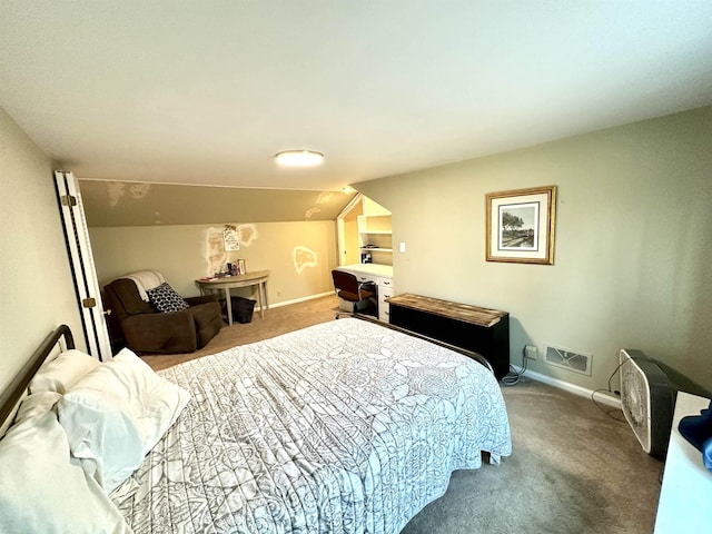 bedroom with vaulted ceiling and carpet floors