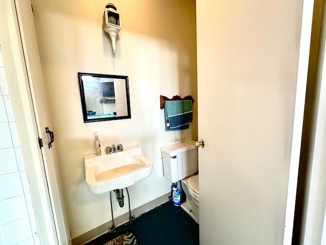 bathroom featuring toilet and sink