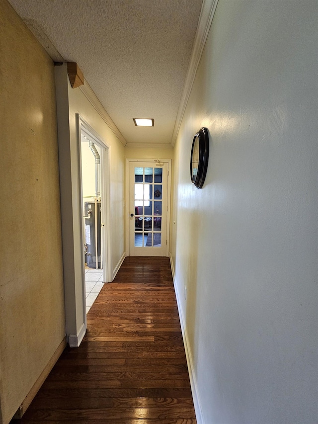  - hallway featuring crown molding, hardwood / wood-style flooring, a textured ceiling, and baseboards