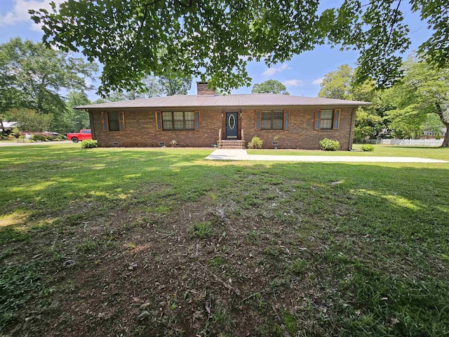  - single story home with a chimney, a front lawn, brick siding, and metal roof