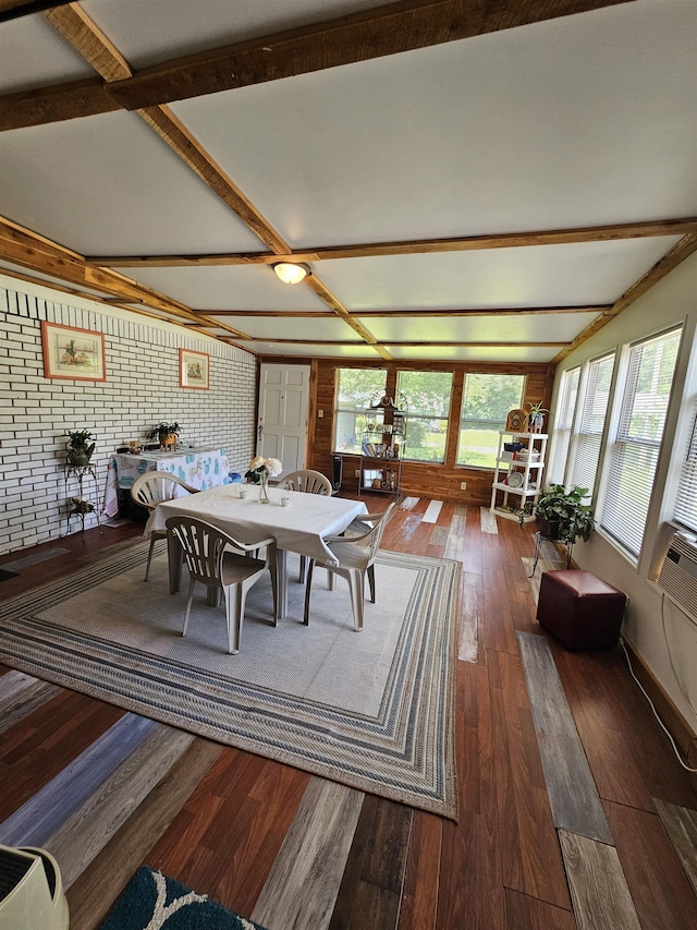  - dining room with wood-type flooring and beamed ceiling