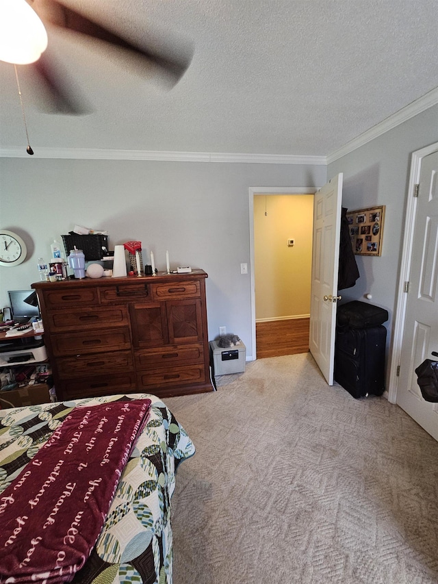  - bedroom with crown molding, carpet flooring, a textured ceiling, and ceiling fan