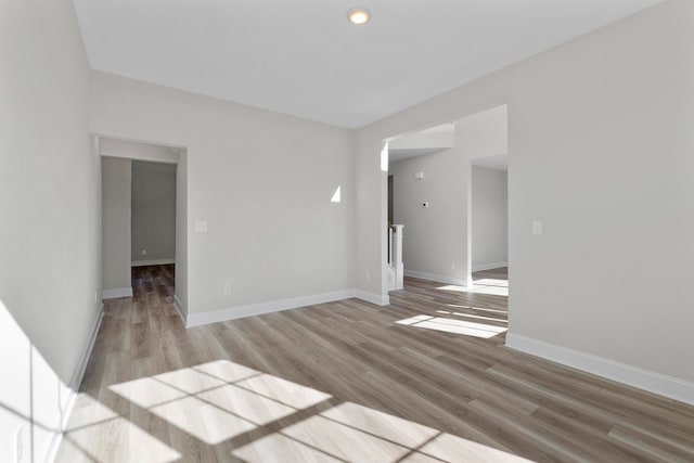 empty room with light hardwood / wood-style flooring