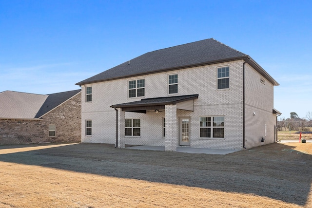 back of house with a patio area