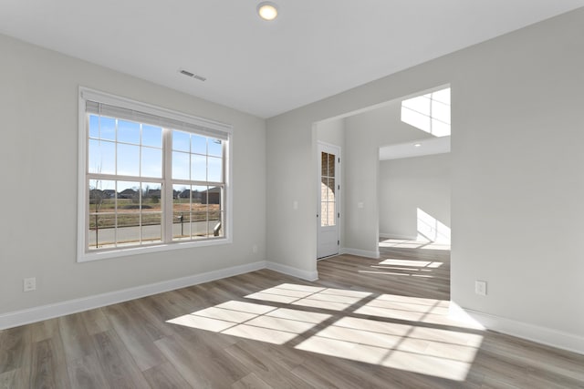 unfurnished room featuring hardwood / wood-style floors