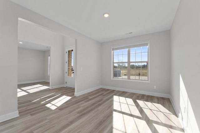 spare room with light wood-type flooring