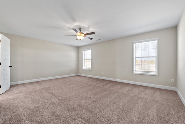 carpeted empty room featuring ceiling fan