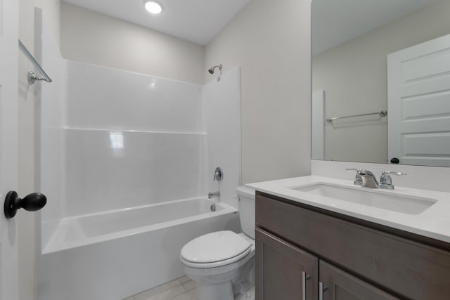 full bathroom with bathtub / shower combination, vanity, tile patterned floors, and toilet