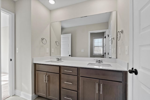 bathroom featuring tile patterned flooring and vanity