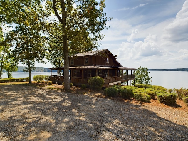 view of property exterior featuring a water view