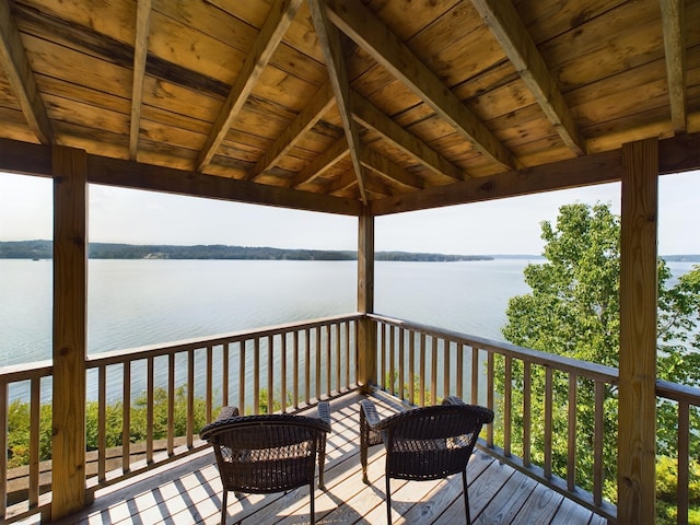 wooden deck featuring a water view