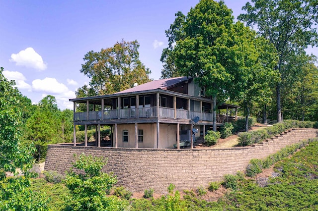 back of house featuring a wooden deck