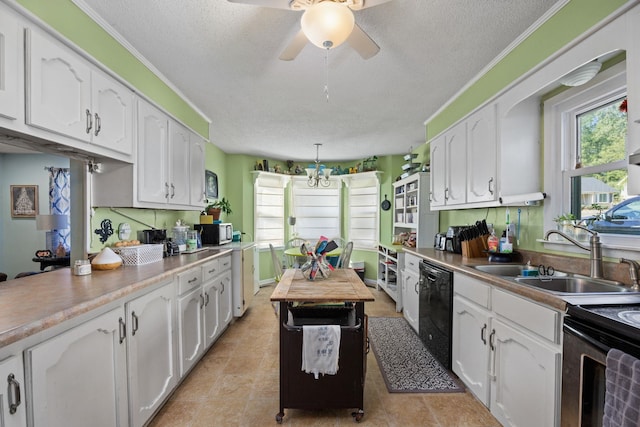 kitchen featuring pendant lighting, sink, ceiling fan, black dishwasher, and white cabinets