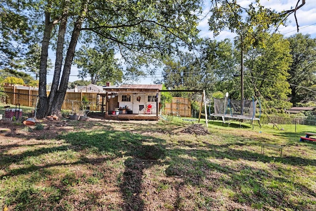 view of yard with a trampoline