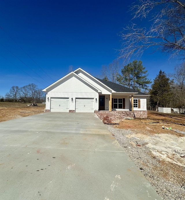 view of front facade featuring an attached garage and concrete driveway