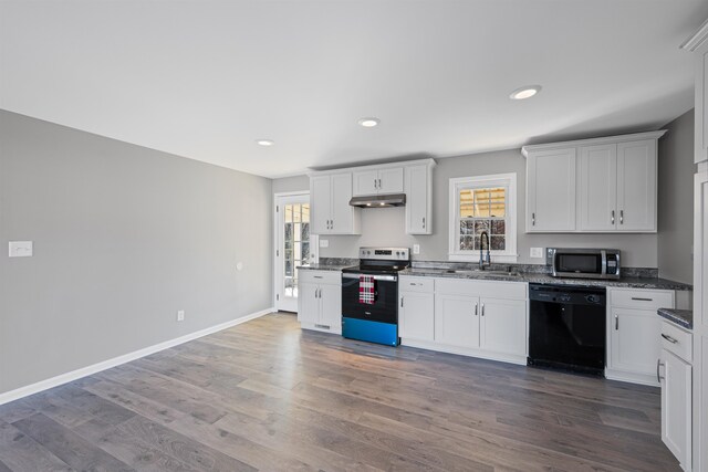 kitchen featuring white cabinetry, a healthy amount of sunlight, appliances with stainless steel finishes, and sink