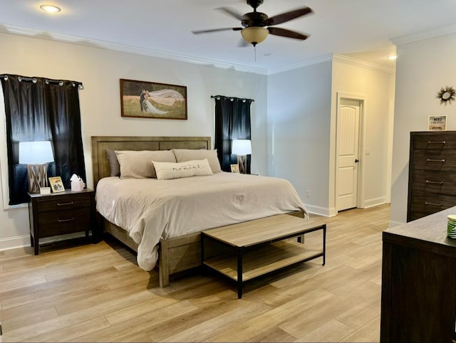 bedroom with light wood-style floors, baseboards, and crown molding