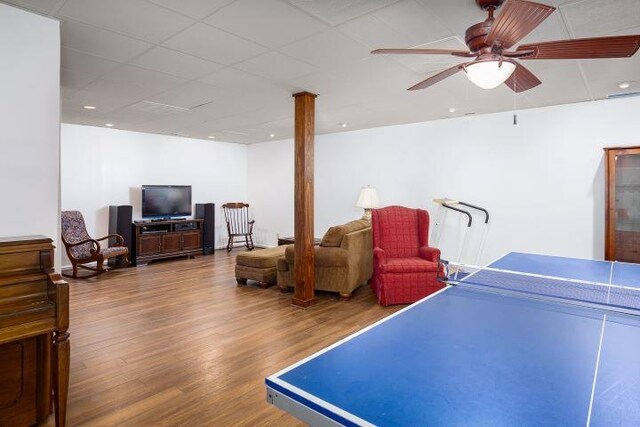  - game room with wood finished floors and a ceiling fan