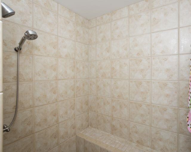  - bathroom with tiled shower
