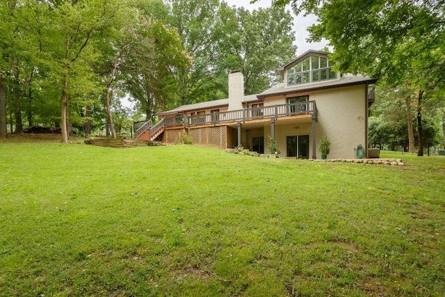  - back of house with a wooden deck, a yard, a chimney, and stairs