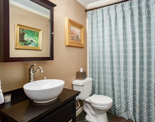  - full bath featuring vanity, crown molding, and a shower with curtain