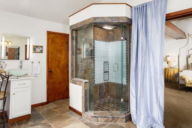  - ensuite bathroom with vanity and a shower stall