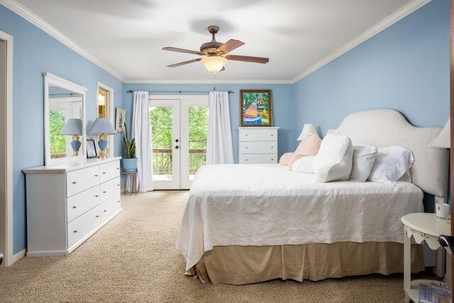  - bedroom featuring access to exterior, light carpet, ornamental molding, french doors, and a ceiling fan