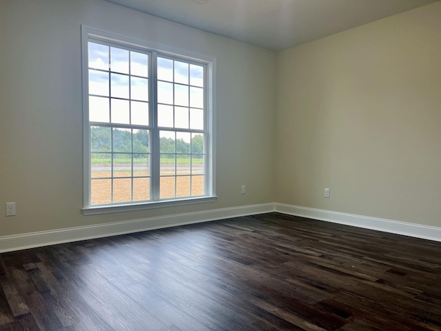 unfurnished room featuring dark hardwood / wood-style floors