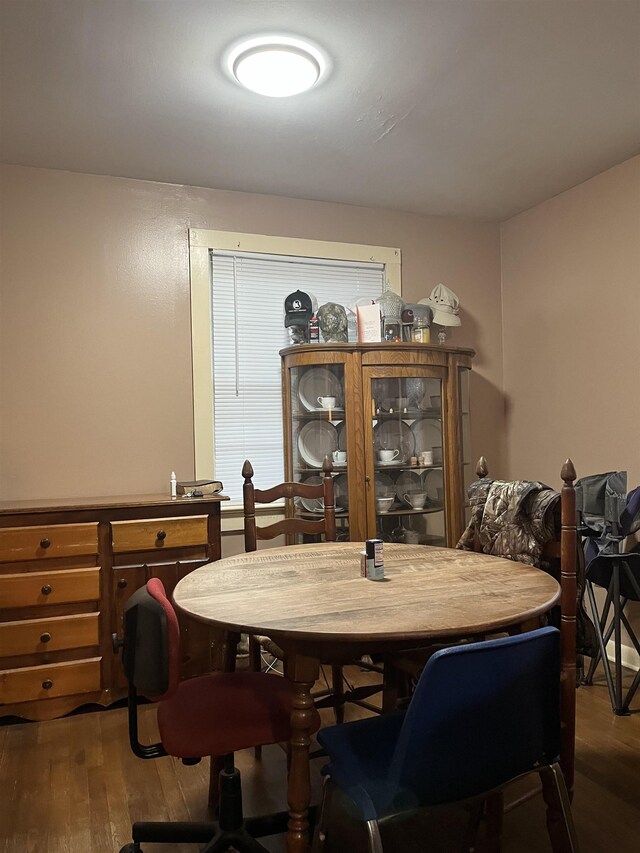 dining area with hardwood / wood-style flooring