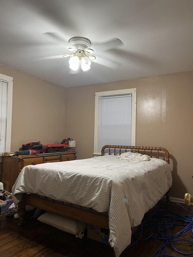 bedroom featuring hardwood / wood-style floors and ceiling fan