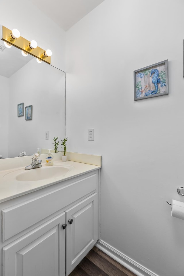 bathroom with wood-type flooring and vanity