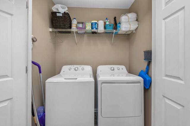 laundry area with washing machine and dryer