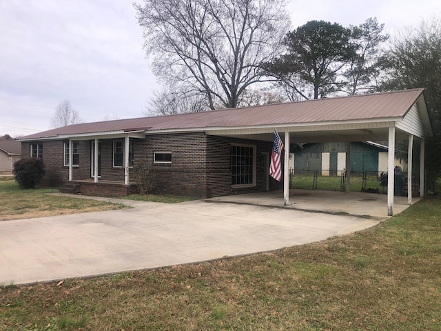 single story home with a carport and a front yard