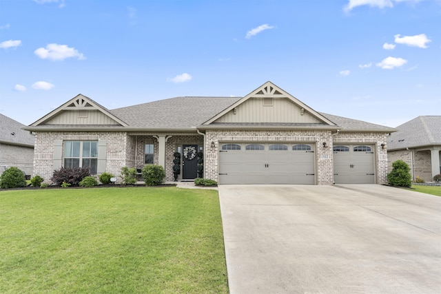  - view of front of property with a garage, a front yard, concrete driveway, and brick siding