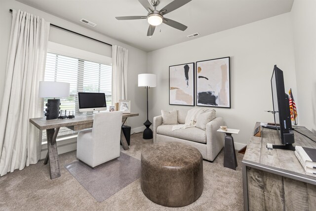  - carpeted office with a ceiling fan and baseboards