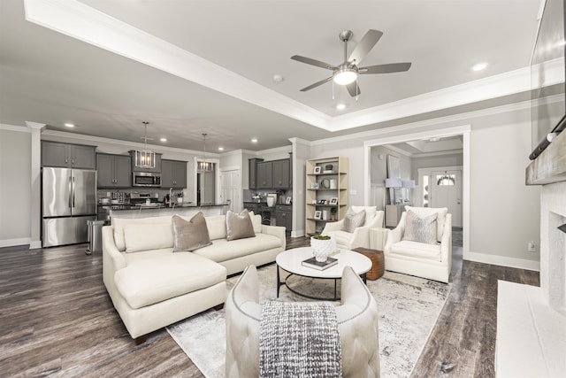 - living room featuring ceiling fan, recessed lighting, baseboards, dark wood-style flooring, and a fireplace