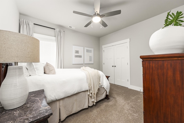  - bedroom with carpet flooring, a closet, baseboards, and a ceiling fan