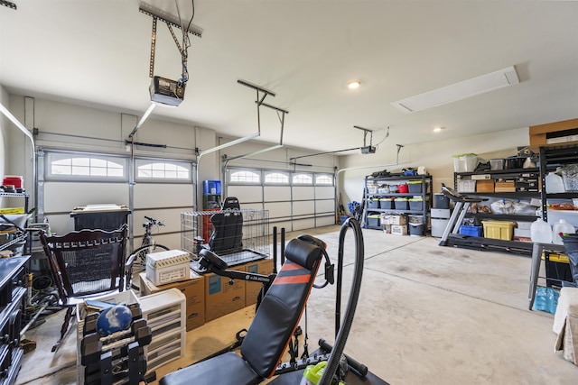  - garage featuring a garage door opener and recessed lighting