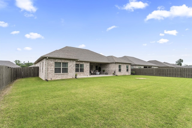  - back of house with brick siding, a patio, and a shingled roof