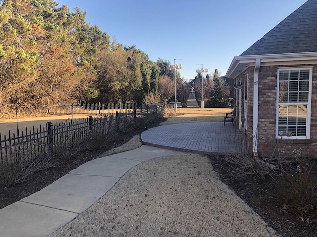 view of yard featuring a patio area and fence