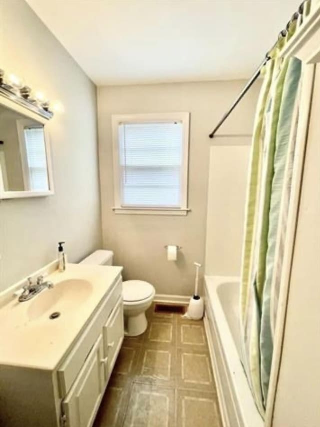 full bathroom with vanity, toilet, and shower / bathtub combination with curtain