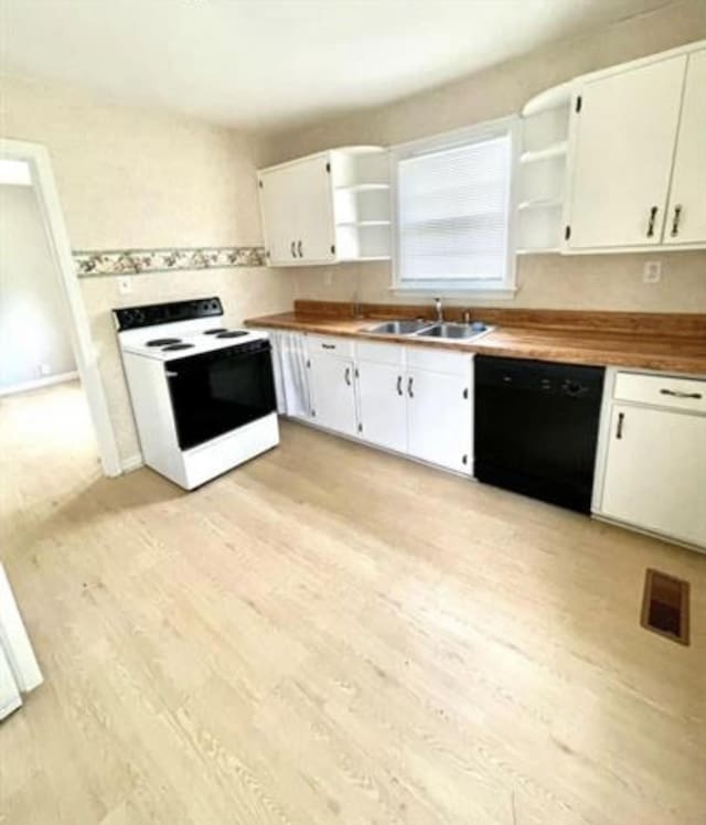 kitchen featuring white range with electric stovetop, sink, white cabinets, and black dishwasher