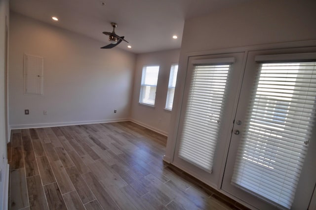 interior space with recessed lighting, french doors, and wood finished floors