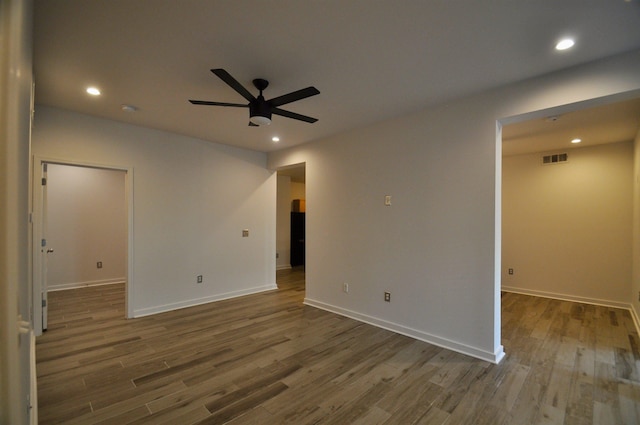 spare room featuring visible vents, recessed lighting, ceiling fan, and wood finished floors