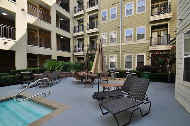 view of swimming pool with a patio area