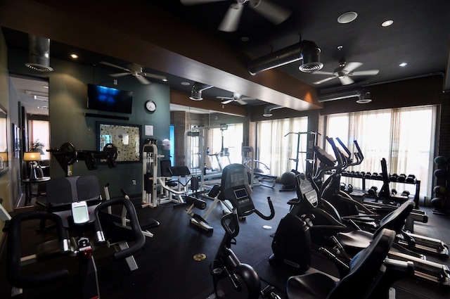 gym featuring visible vents and ceiling fan