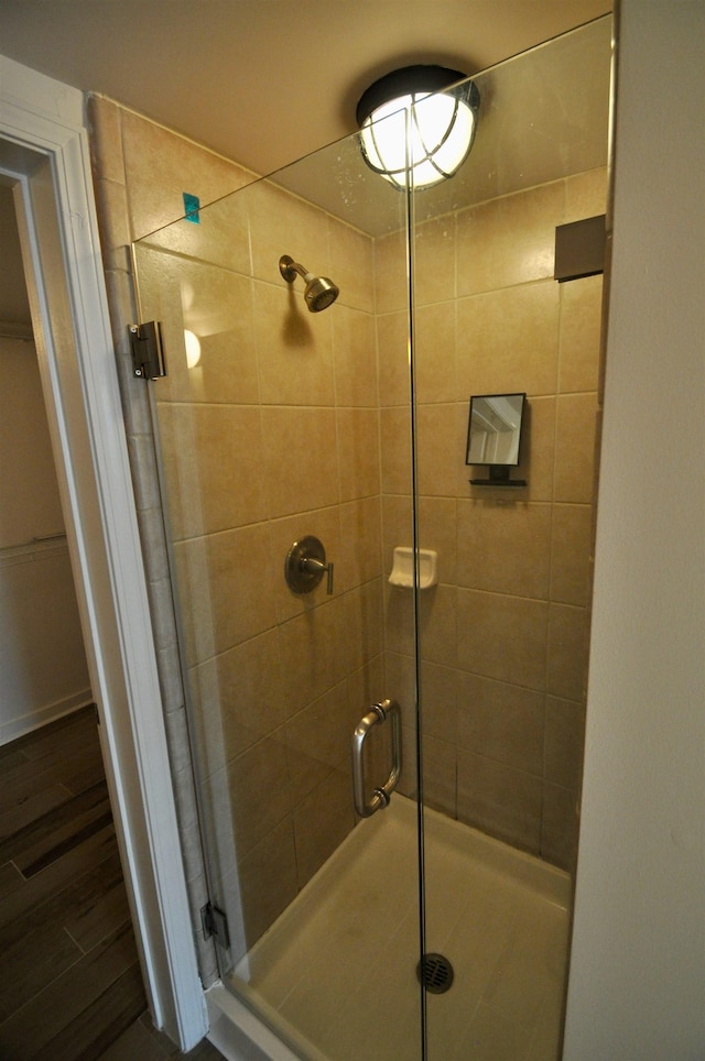 bathroom with a shower stall